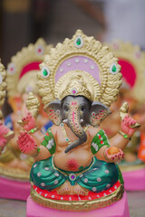 Lord Ganesha idol for Ganesh Chaturthi festival in India, Colorful Ganpati statue Stock Photo, Lord...
