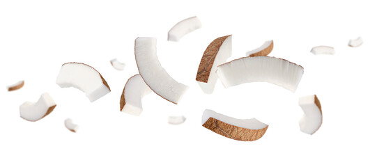 Thin semicircular slices of coconut fly and levitate in space. Isolated on white