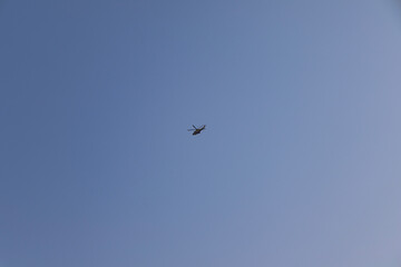 Helicopter flying in the sky. Viareggio Italy.