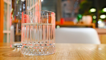 Glass of water on a wooden table