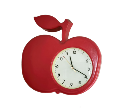 Red apple shaped wall clock with white dial and black hands isolated on transparent PNG background. Bright and colorful clock, perfect for kitchen or classroom.