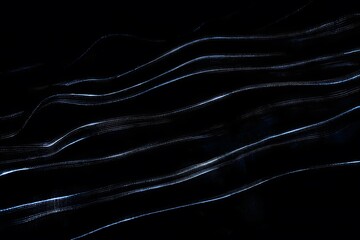 Indigo and silver wave lines glowing fluidly, sleek motion, clean lower zone for branding
