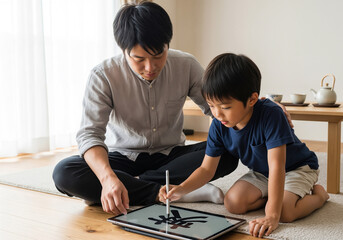 Japanese father and son practicing digital calligraphy on tablet