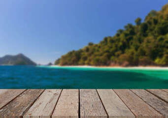 Wooden table top on the beach or sea.Party on the beach  sunshine time concept.For montage product display or design key visual layout.View of copy space.