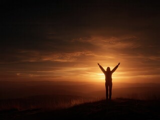 silhouette of a person standing on a hill with raised arms