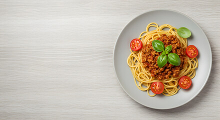 Spaghetti with Tomato Sauce and Basil Plate of spaghetti with tomato sauce, cherry tomatoes, and basil leaves