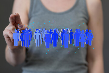 Stock photo of a woman interacting with a digital network representing people, connections, and community.