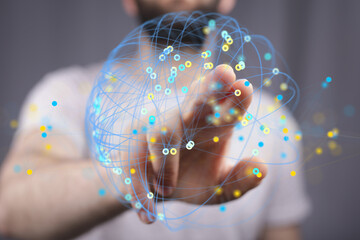 Stock photo of a person interacting with a digital network visualization, representing global connectivity and data flow.