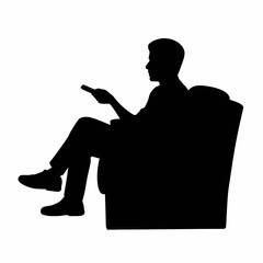 Silhouette of a Man Sitting on a Couch with Remote