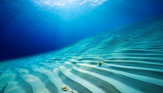 idyllic undersea scene illuminated by sunlight glistening tropical aqua ocean and smooth light dune