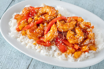 Sweet sour prawns with pineapple bell peppers onions served with rice
