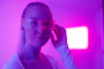 Woman in futuristic glowing glasses
