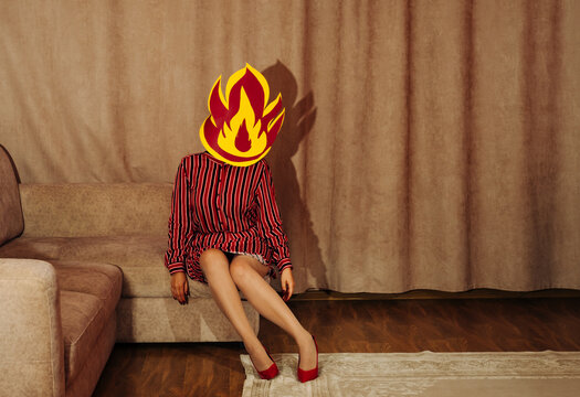 Conceptual portrait of a woman in retro style with fire head depicting burnout