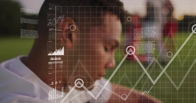 Seated soccer athlete gazing on dusk pitch activating tech HUD graphs map visualizing performance - Powered by Adobe
