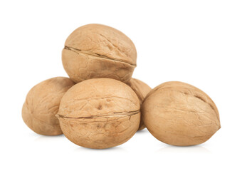 Five walnuts stand out on a transparent background