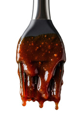 Glistening thick amber-brown bbq sauce covering a silicone basting brush, isolated on neutral gray studio, extreme close-up, appetizing culinary readiness