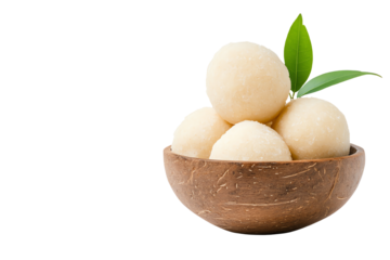 Delicious sweet balls in a wooden bowl with green leaves, perfect for desserts or snacks.