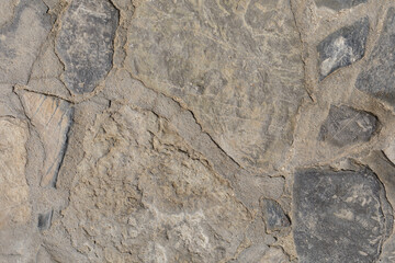 High-resolution image of a grey stone pavement texture. Ideal for backgrounds, websites, and design projects.