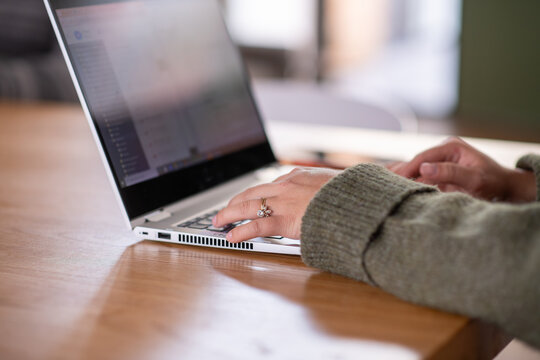 woman using laptop at home