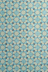 teal blue and moss green pattern with circles and square in an antiqued style
