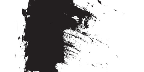 Fototapeta premium An abstract brushstroke image in black ink against a stark white backdrop. The bold dark mass bleeds into broken textures, resembling erosion, stormy skies, or weathered surfaces. A modern expression