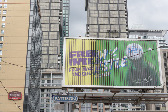 trifold billboard featuring Mullvad VPN service and Steam Whistle Brewery near Windsor Street and Front Street West Toronto (Marriott Residence Inn)