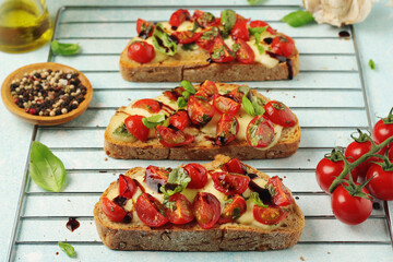 Freshly made bruschetta sandwiches - traditional dish of Italian cuisine	