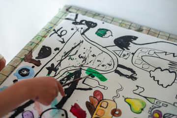Naklejka premium Abstract ink drawing painting crafts arts kids hand child painting with paintbrush black lines coloured in