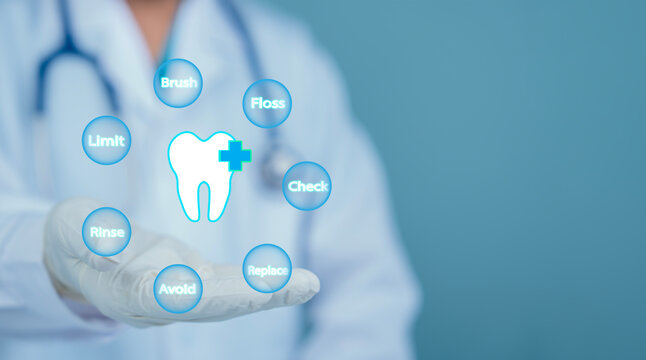 Dentist showing virtual infographic with tooth health care tips brush floss rinse check limit avoid replace for oral hygiene and dental protection