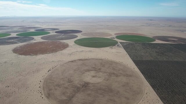 Yuma Arizona USA &ndash; 4K Drone Aerial of Irrigation and Circular Crop Fields with Tractors