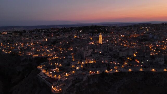 Aerial Evening View of Matera in Basilicata, Southern Italy &ndash; Historic Old Town Illuminated at Dusk