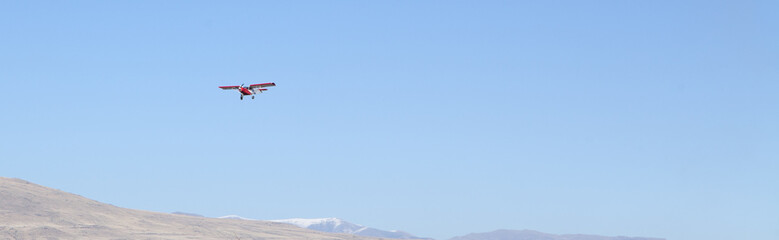 flying plane in the mountains