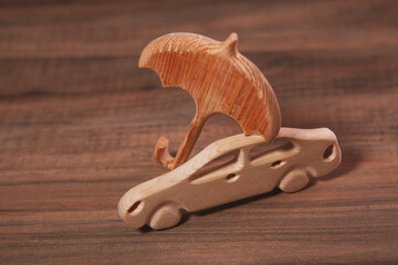 toy wooden car on a gray background.