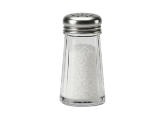 Isolated clear salt shaker filled with crystalline granules for kitchen table condiment