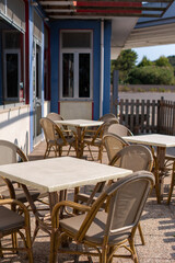 Outdoor café tables with wicker chairs in Italy