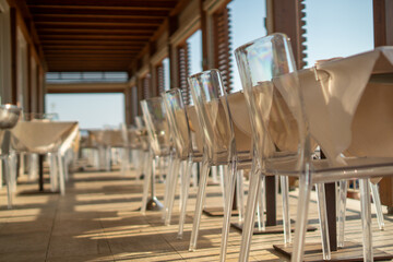 Sunlit café tables with chairs