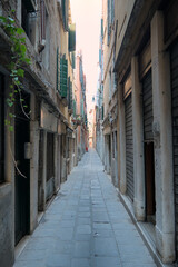 Narrow alleyway Calle de l’Oca in Venice, Italy