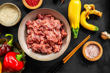 Marinated beef and vegetables for making Asian beef stir fry top view