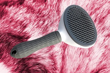 comb for pets. comb for collecting hair from animals and combing it along the background of the surface of the fur