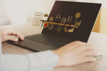 The image conveys that businesspeople or employees are working using policies to oversee business operations.