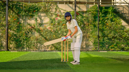 Indian young adult gen z sports woman lady standing hold bat play learn cricket match do practice...