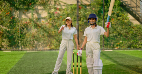 Indian gen z young adult woman lady wear hand gloves white dress leg guard helmet day time cricket...