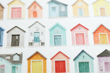 Minimalist children's book use pencil art of garage doors and houses in different colors, on a white background.