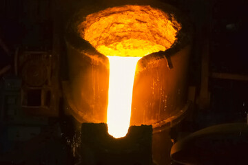 Ladle with molten iron pouring steel blast furnace workshop.