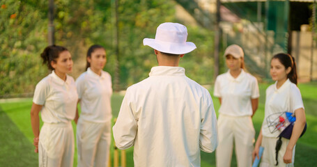 Indian asian young adult gen z woman lady group team standing coach man do sports discussion at...