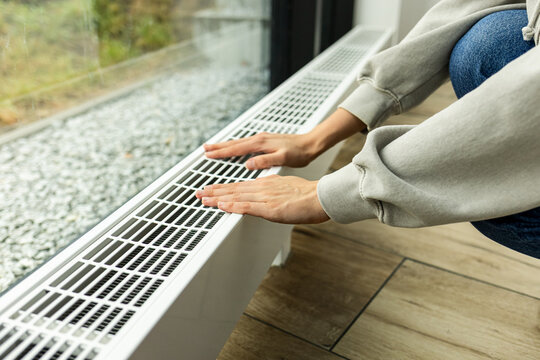 modern radiator for heating in the apartment with power regulators. ideal for those costs of heating and utilities in winter, person regulates the level of heat