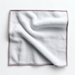 Neatly folded white textured towel with lavender border laying flat on white background