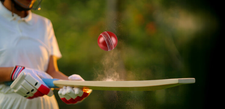 unknown athlete sports woman hand close up hold bat play with red ball outdoor ground. female girl cricket player wear white uniform protective helmet gloves standing at match playground - Powered by Adobe