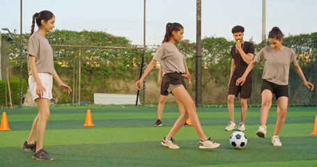 Indian young adult gen z coach man blow whistle sport woman lady play casual football outdoor...