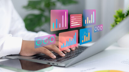 Businessman using laptop with digital data analytics dashboard, futuristic business technology concept